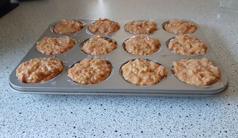 Muffin batter in a tin, ready for the oven